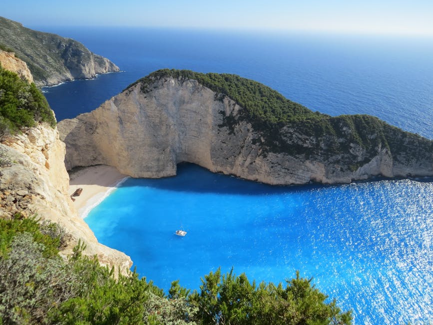 A breathtaking view of Navagio Beach with azure waters surrounded by cliffs in Greece